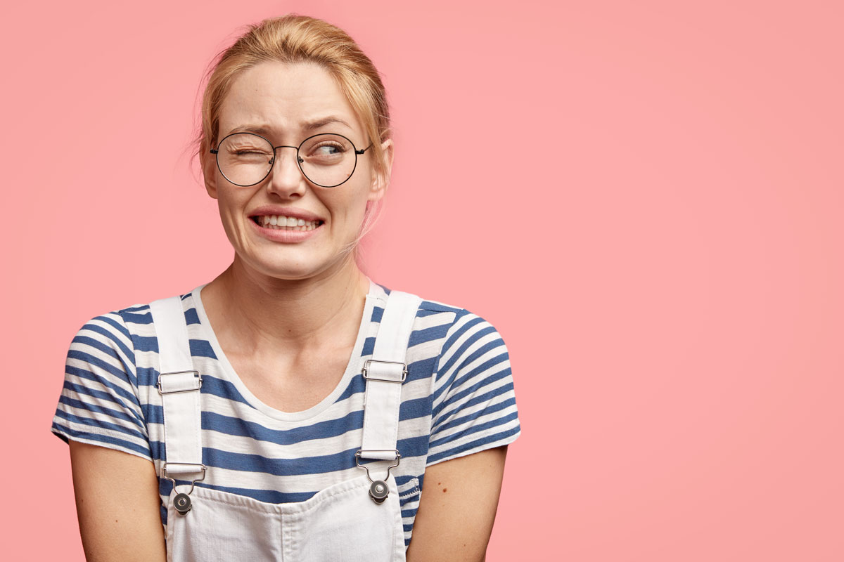 girl grimacing at a mistake